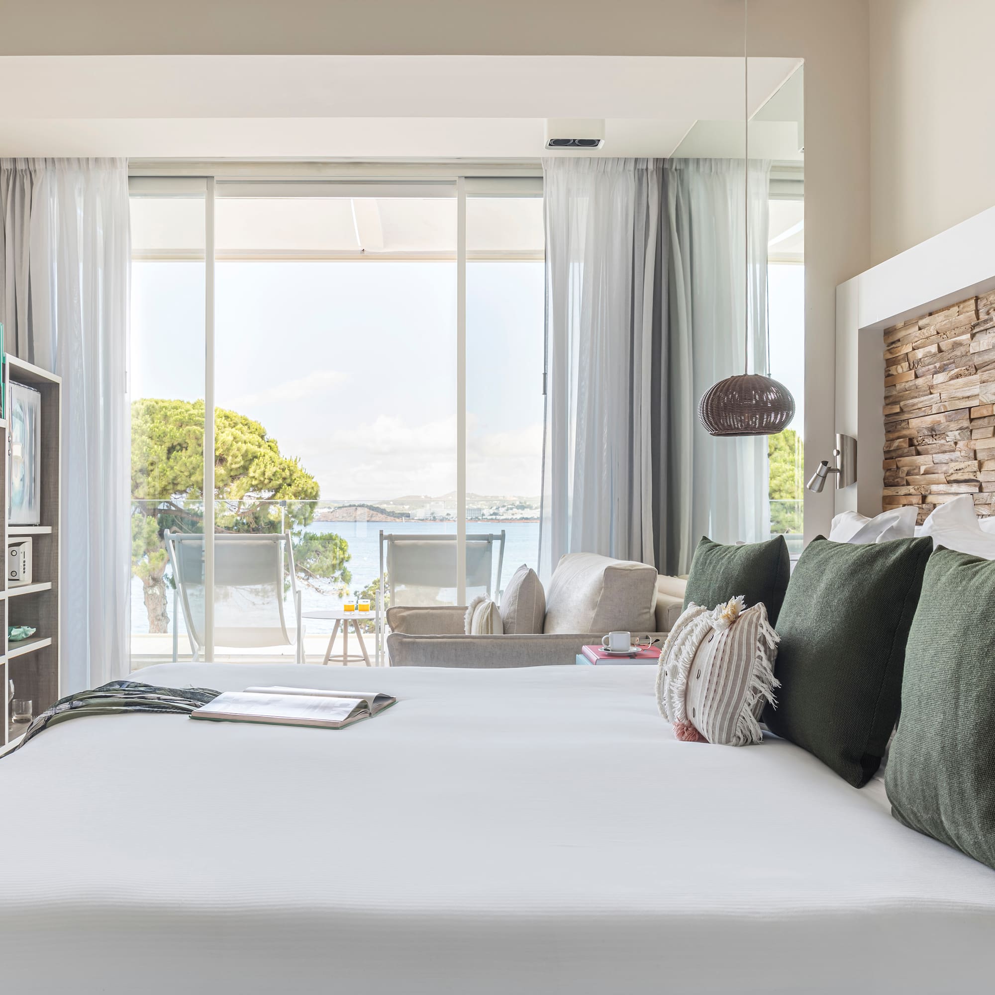a bed with pillows and a book on it