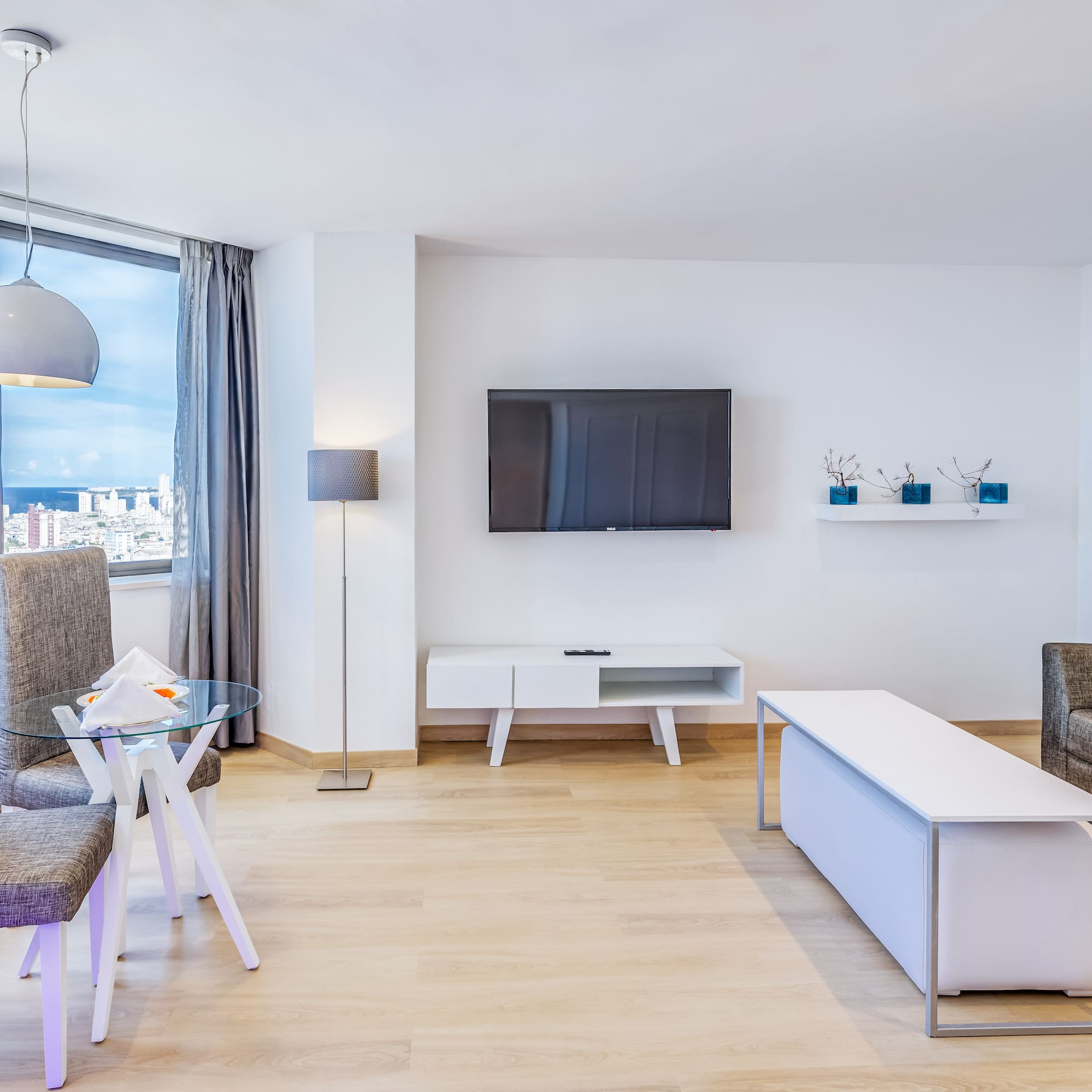 a living room with a tv and a table