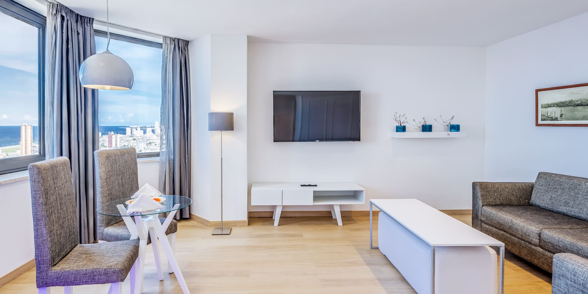 a living room with a tv and a table