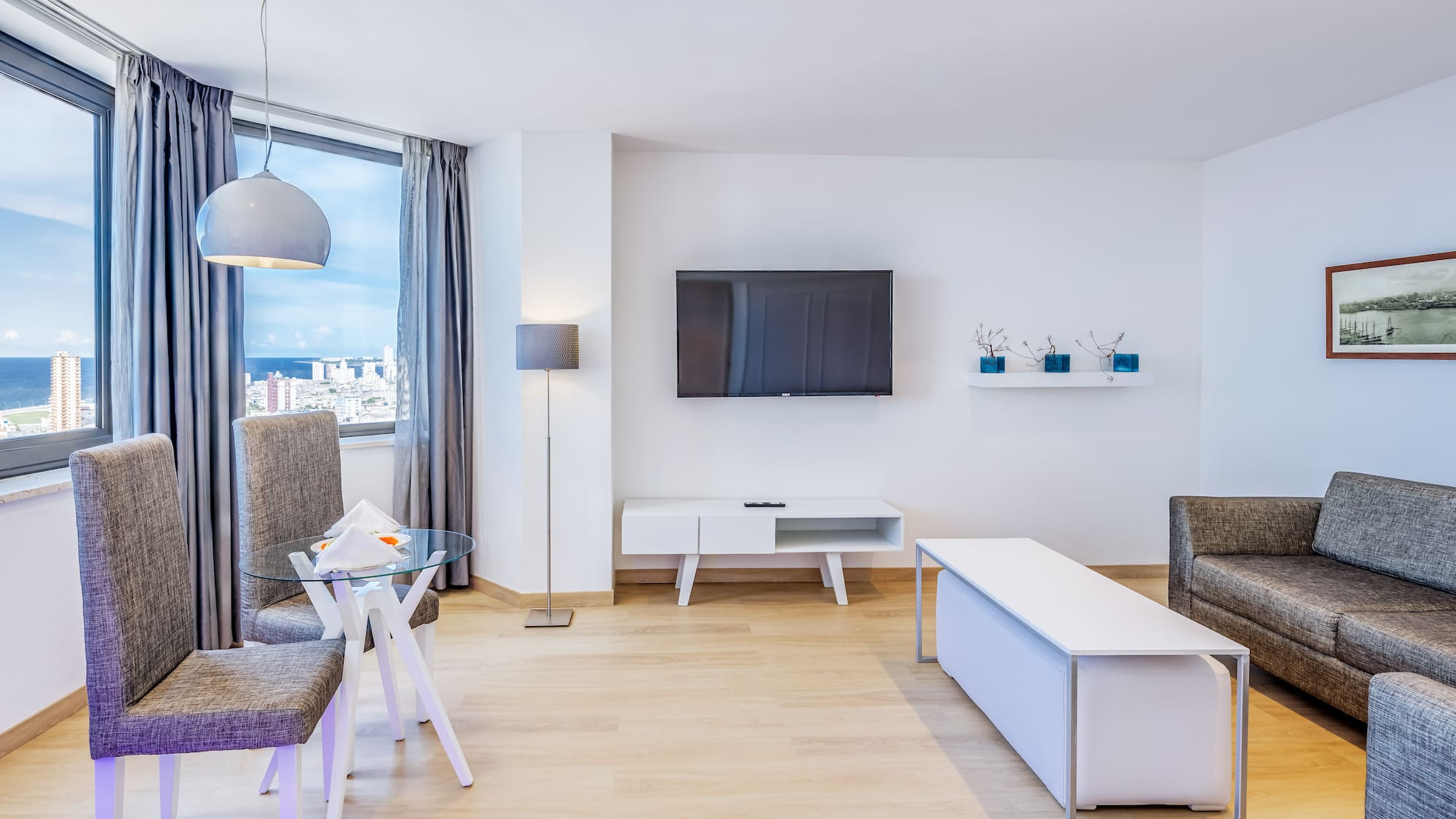a living room with a tv and a table