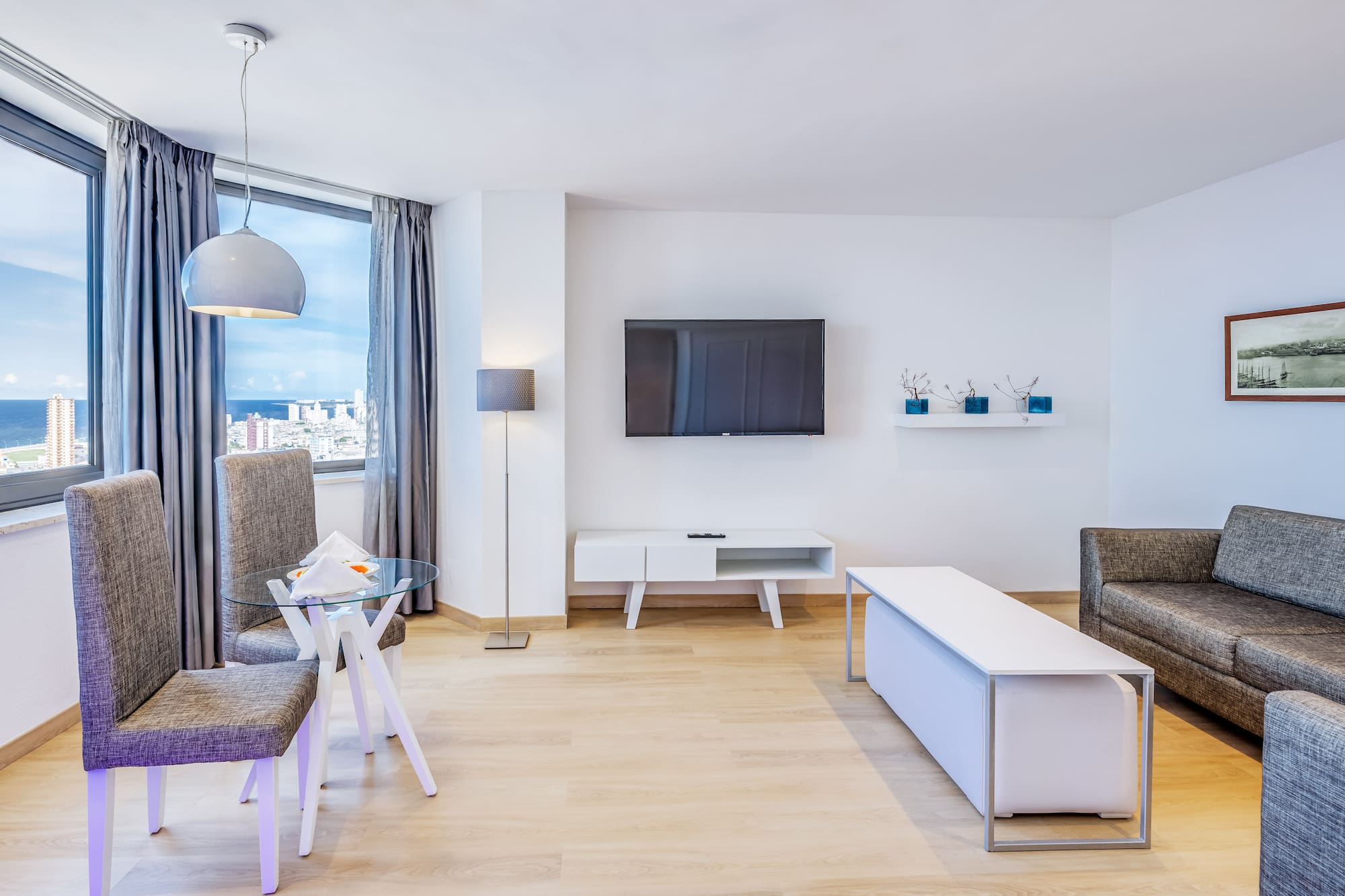 a living room with a tv and a table
