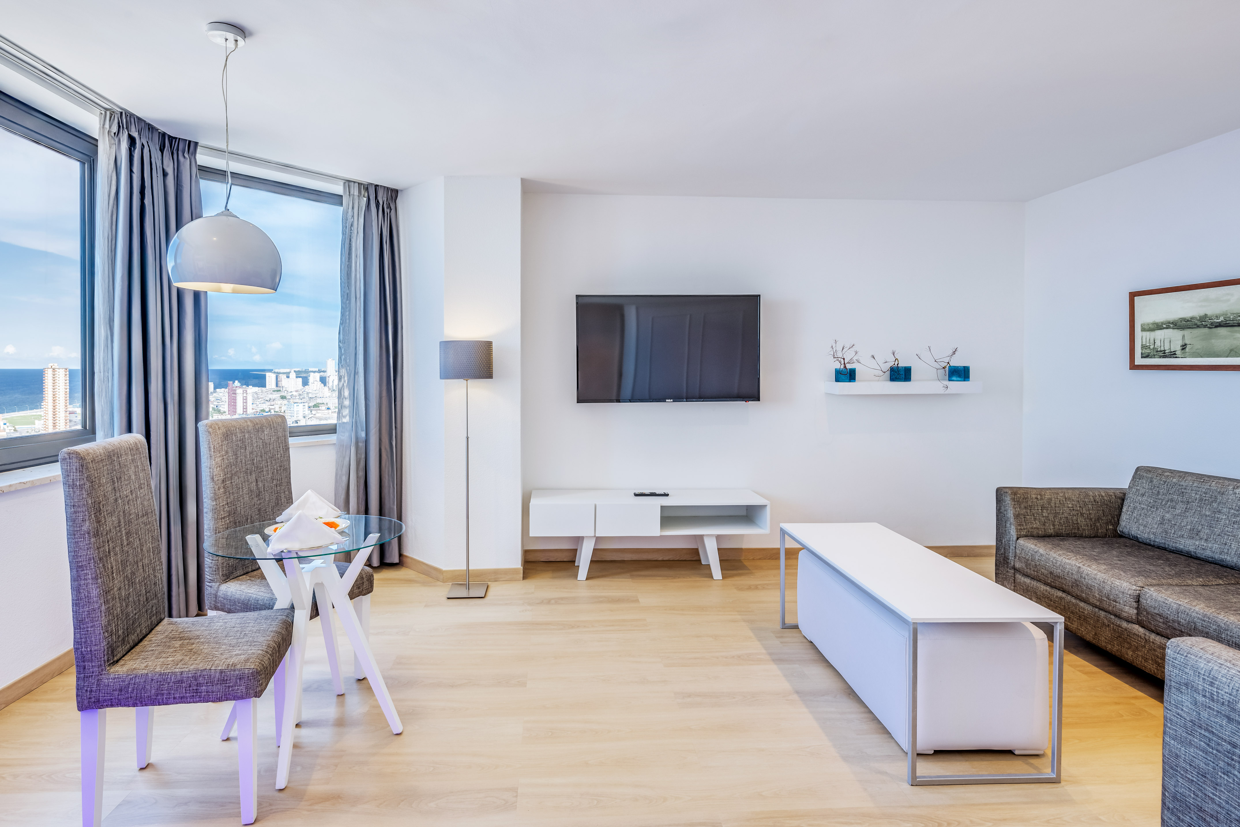 a living room with a tv and a table
