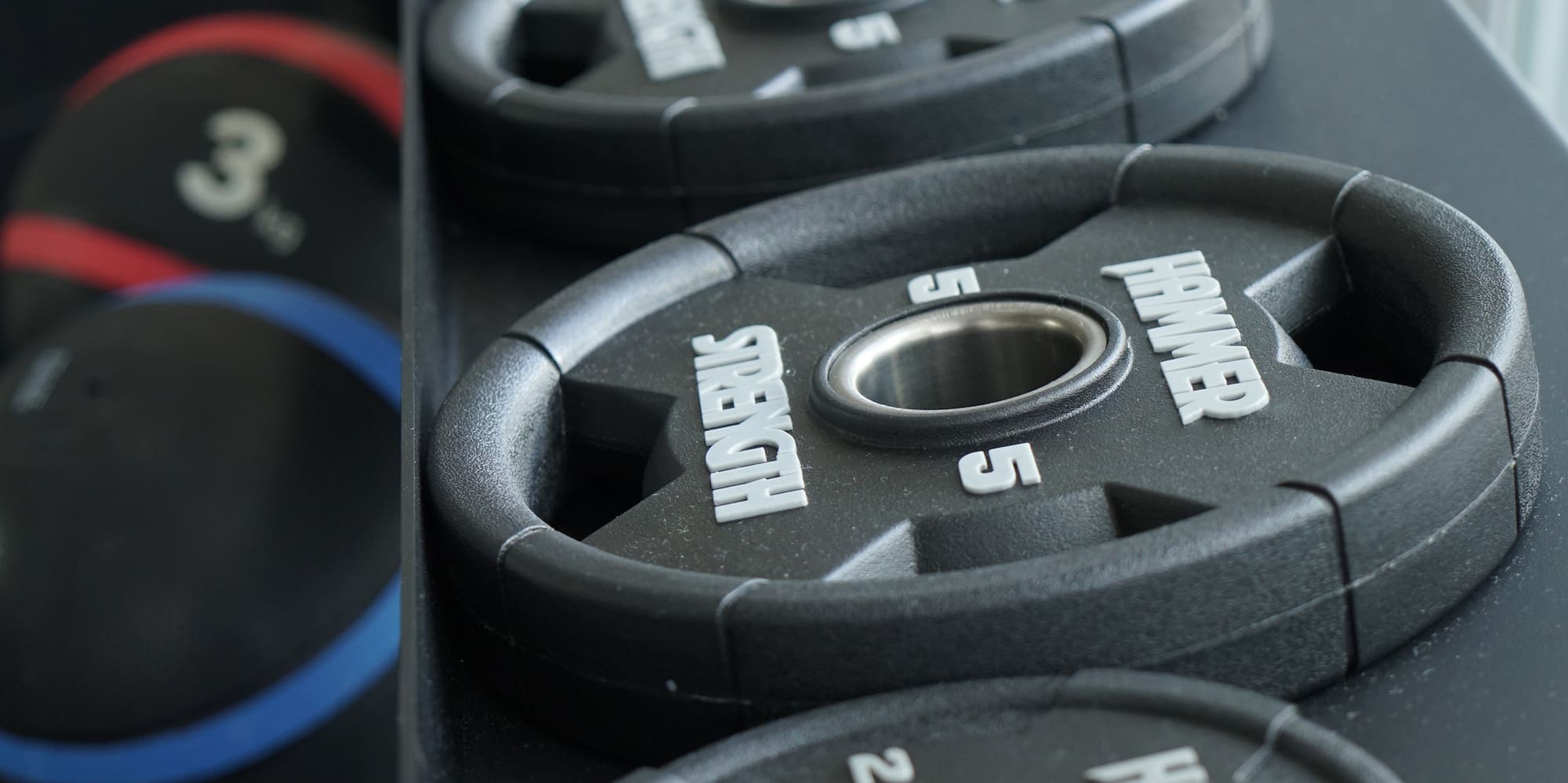 a row of weights on a shelf