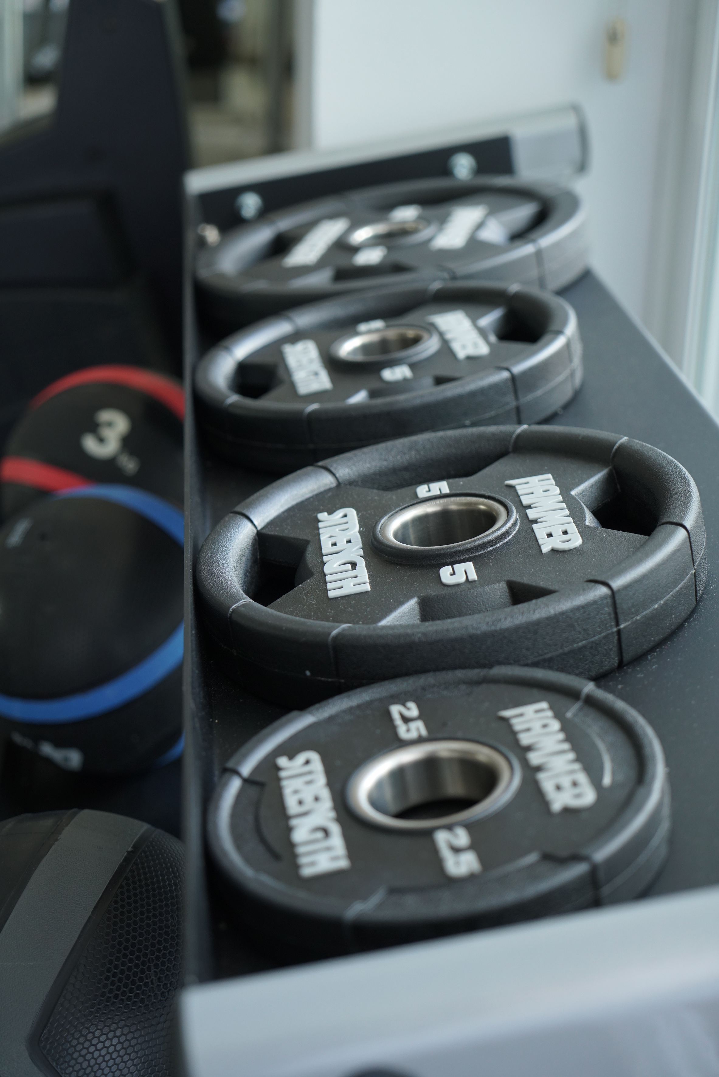 a row of weights on a shelf