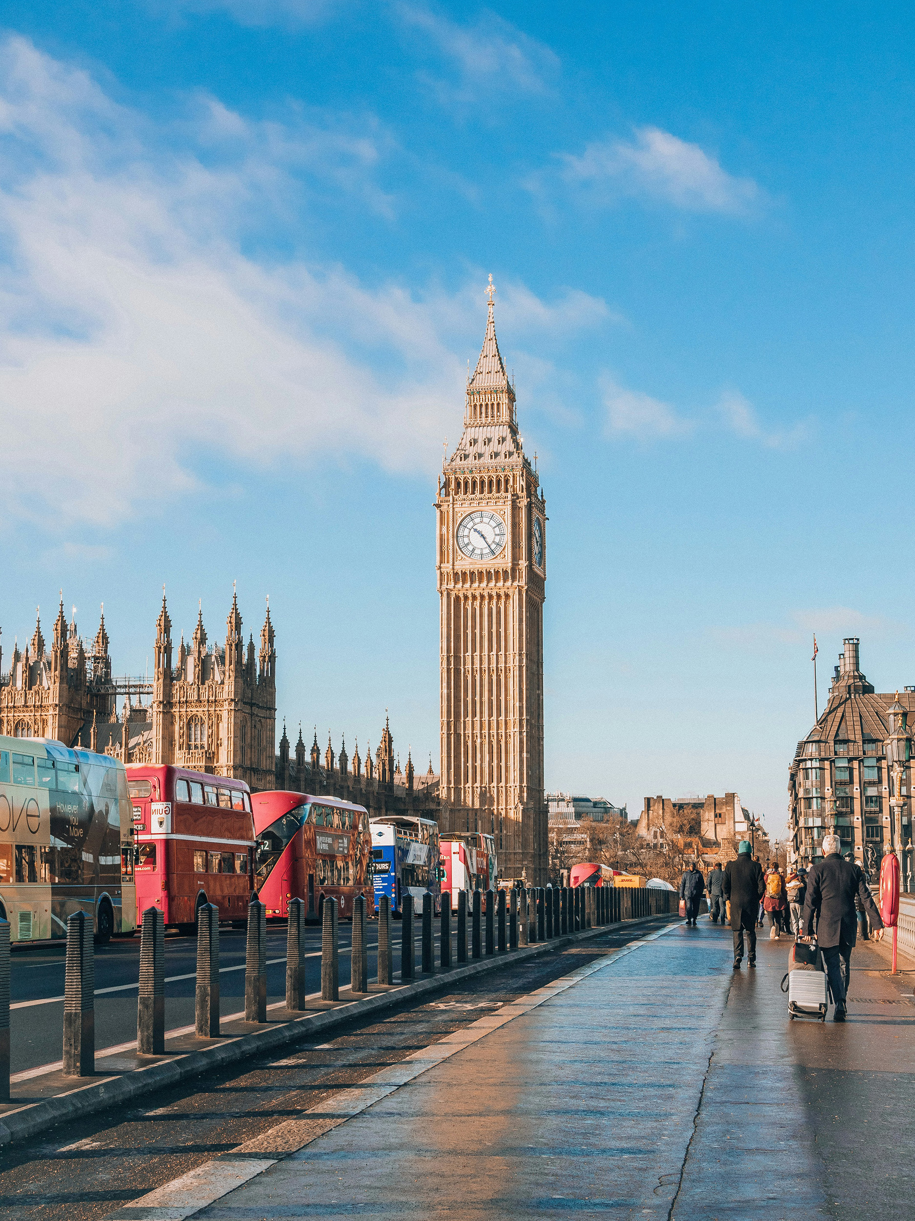 a large clock tower in london with Big Ben in the background