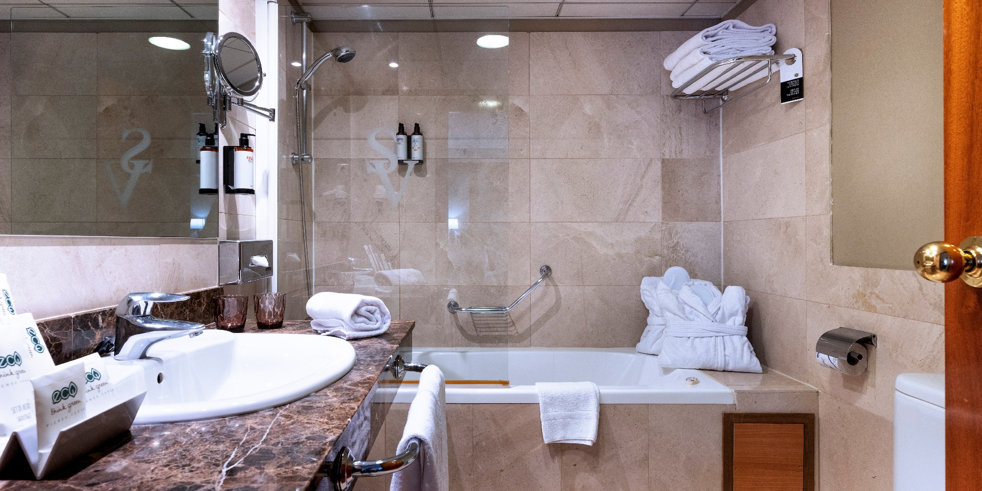 a bathroom with a sink toilet and tub