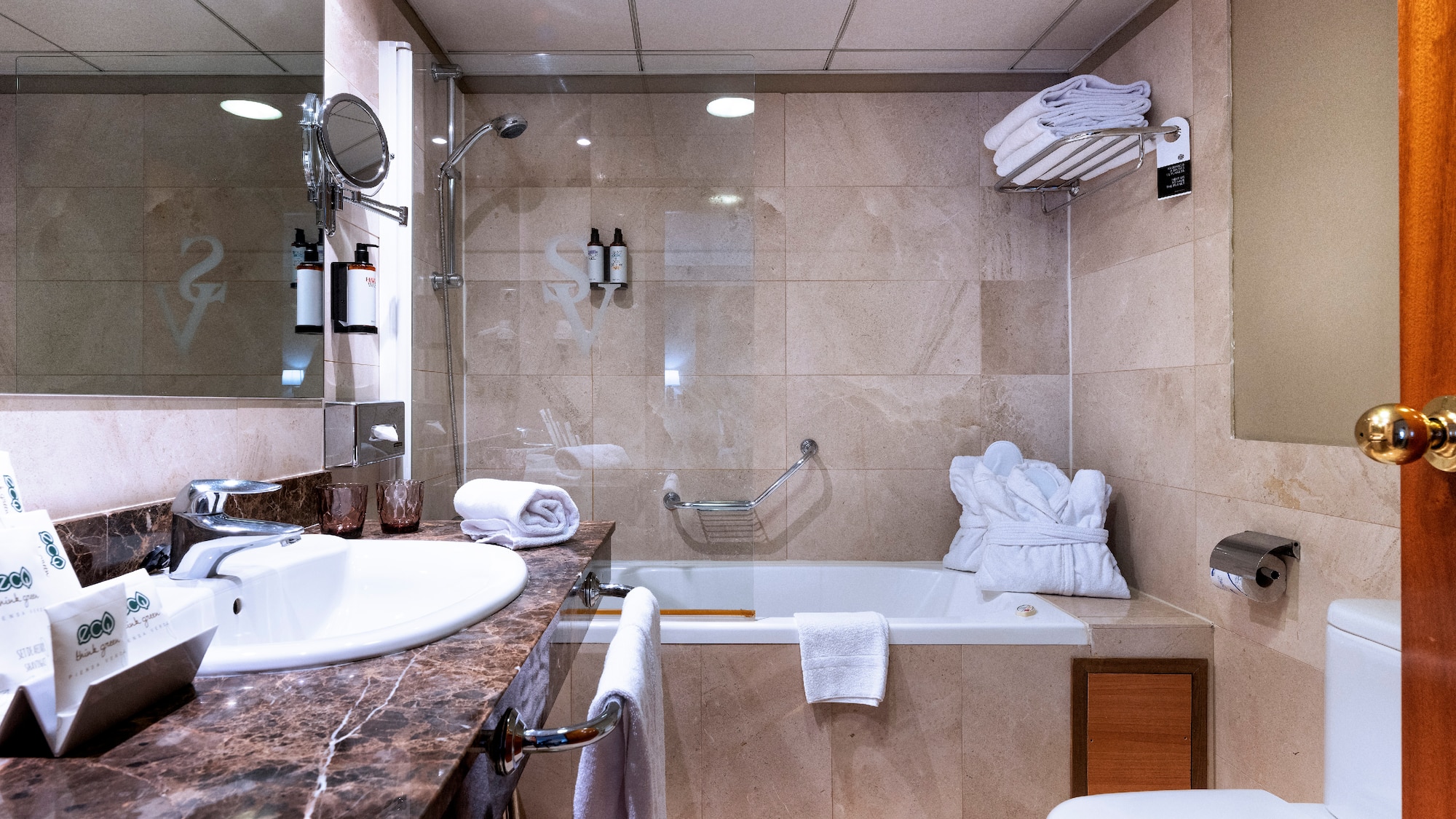 a bathroom with a sink toilet and tub