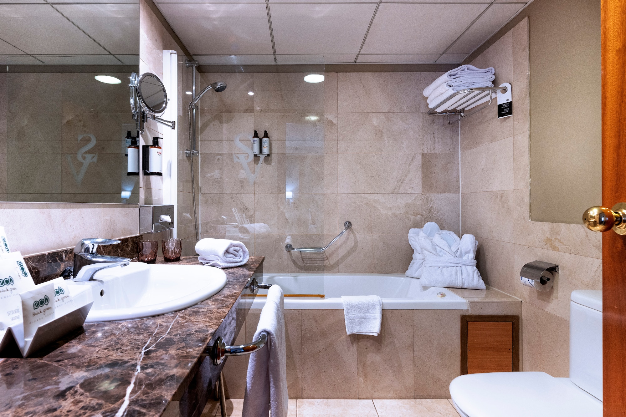 a bathroom with a sink toilet and tub