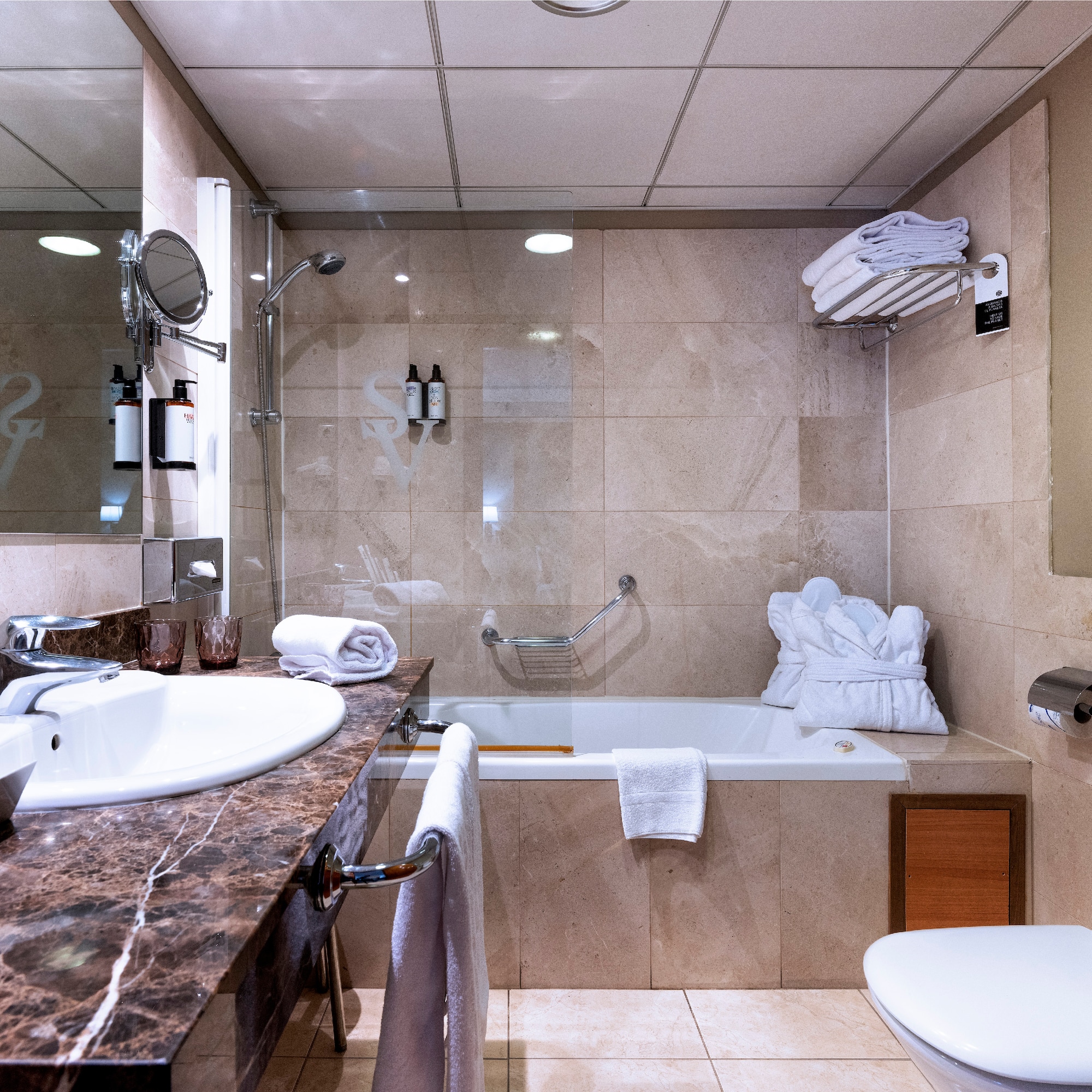 a bathroom with a sink toilet and tub