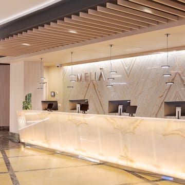 a reception desk in a hotel