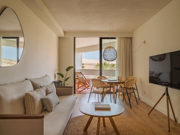 a living room with a couch and table