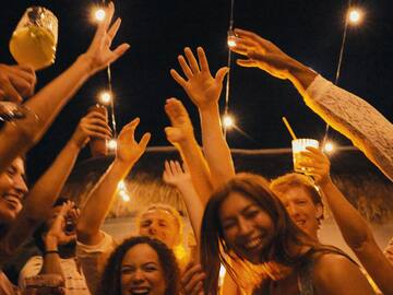 a group of people holding up their hands