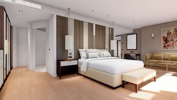 a bedroom with a bed and a mirror