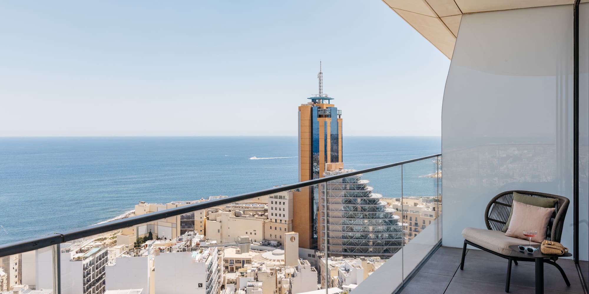 a balcony overlooking a city