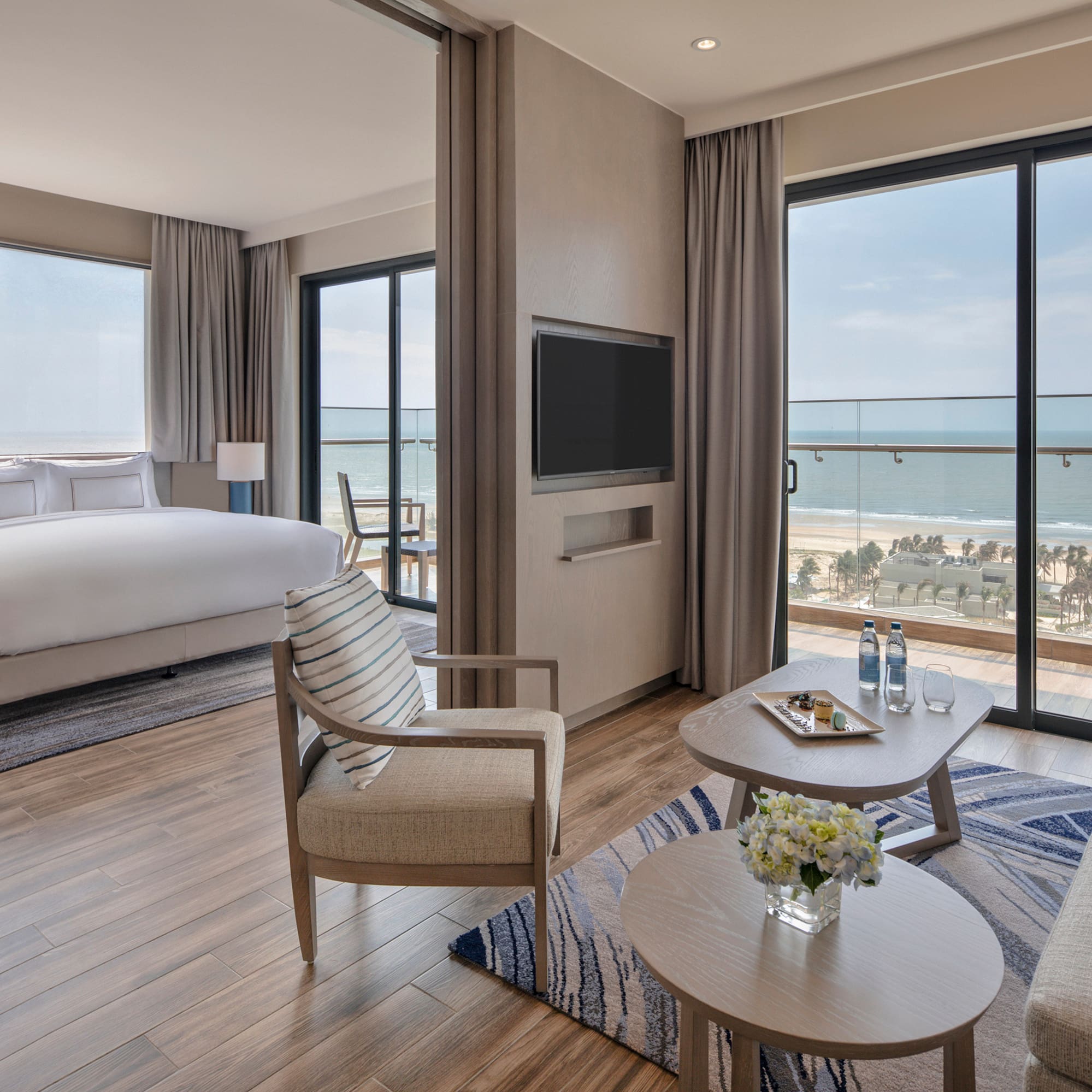 a room with a bed and a television