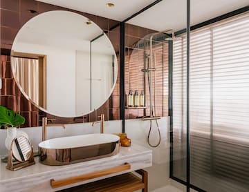a bathroom with a sink and shower
