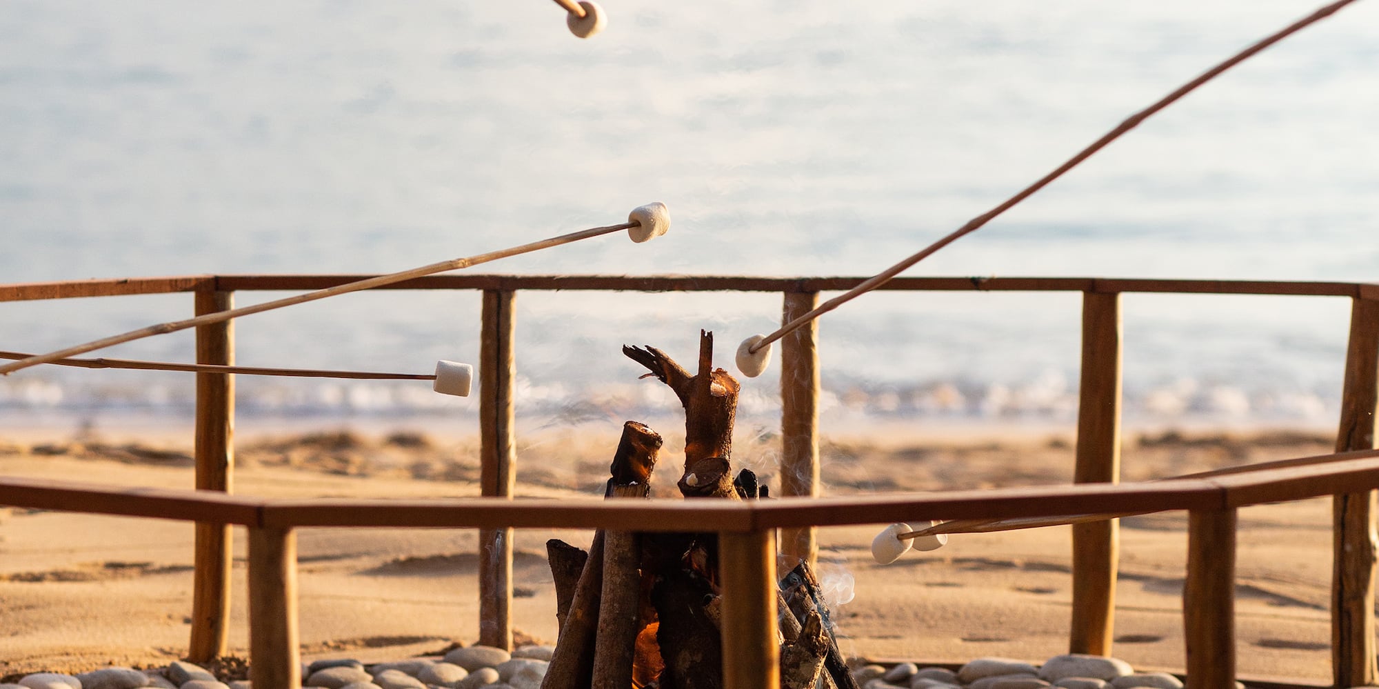 a fire pit on a beach