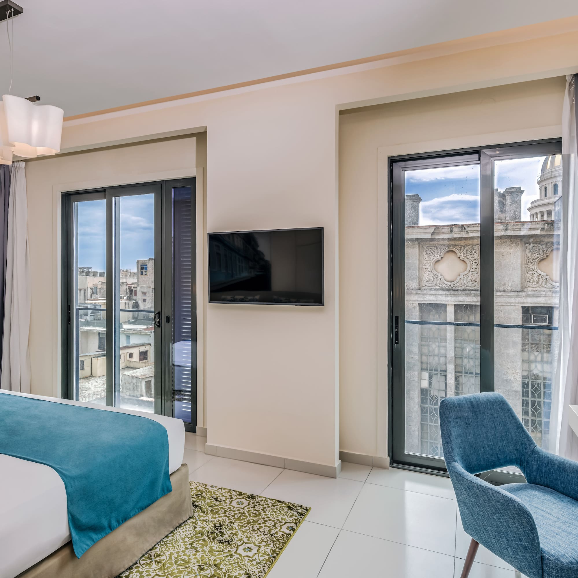 a bedroom with a tv and a bed