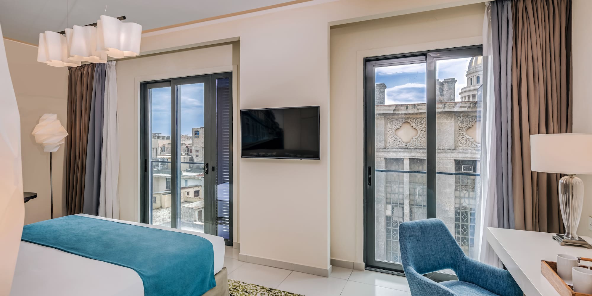 a bedroom with a tv and a bed