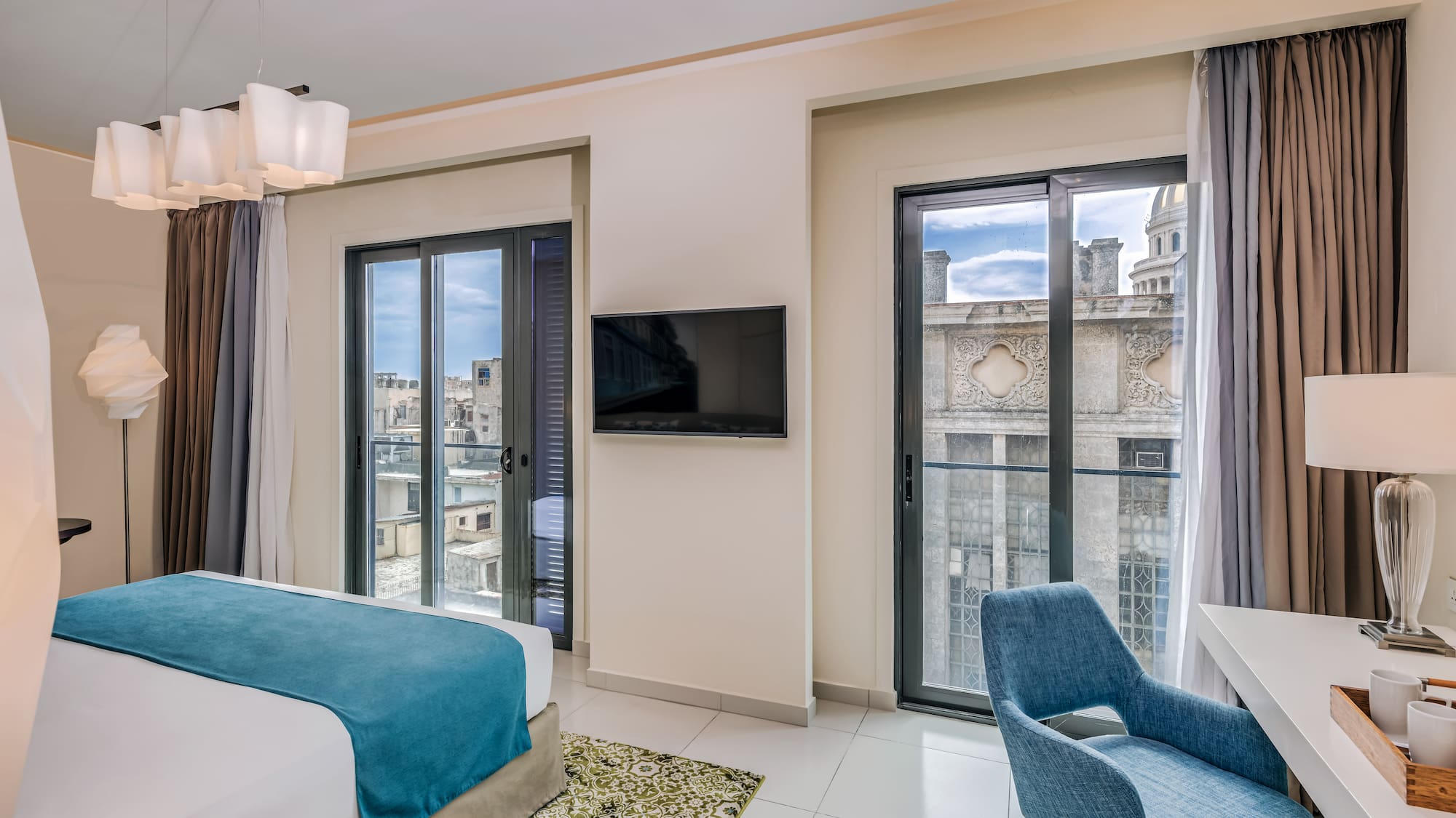 a bedroom with a tv and a bed