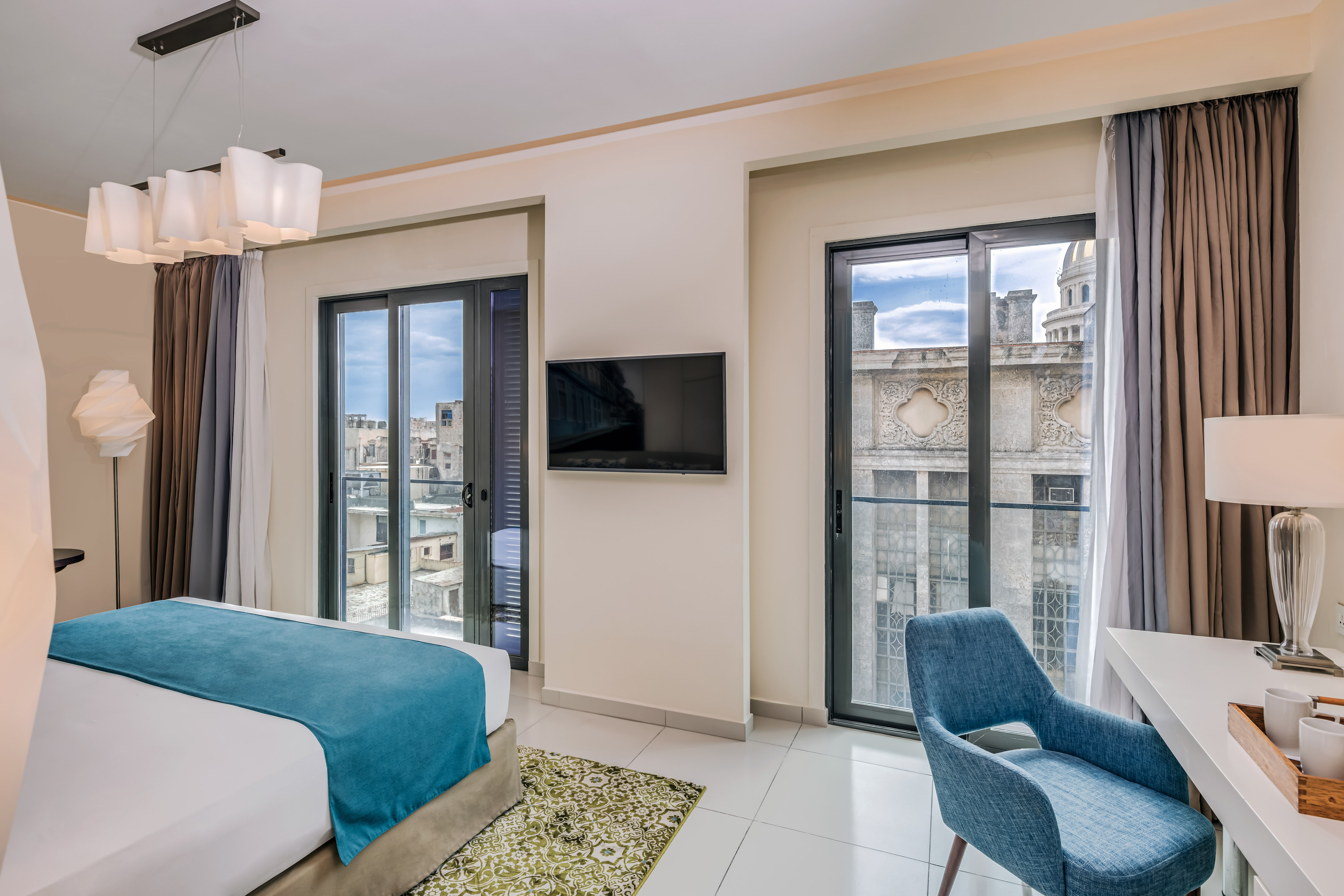 a bedroom with a tv and a bed