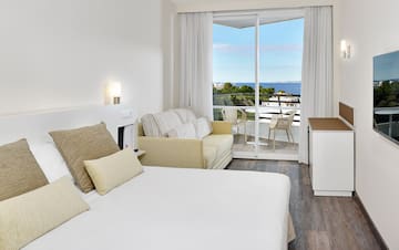 a room with a bed and a fireplace