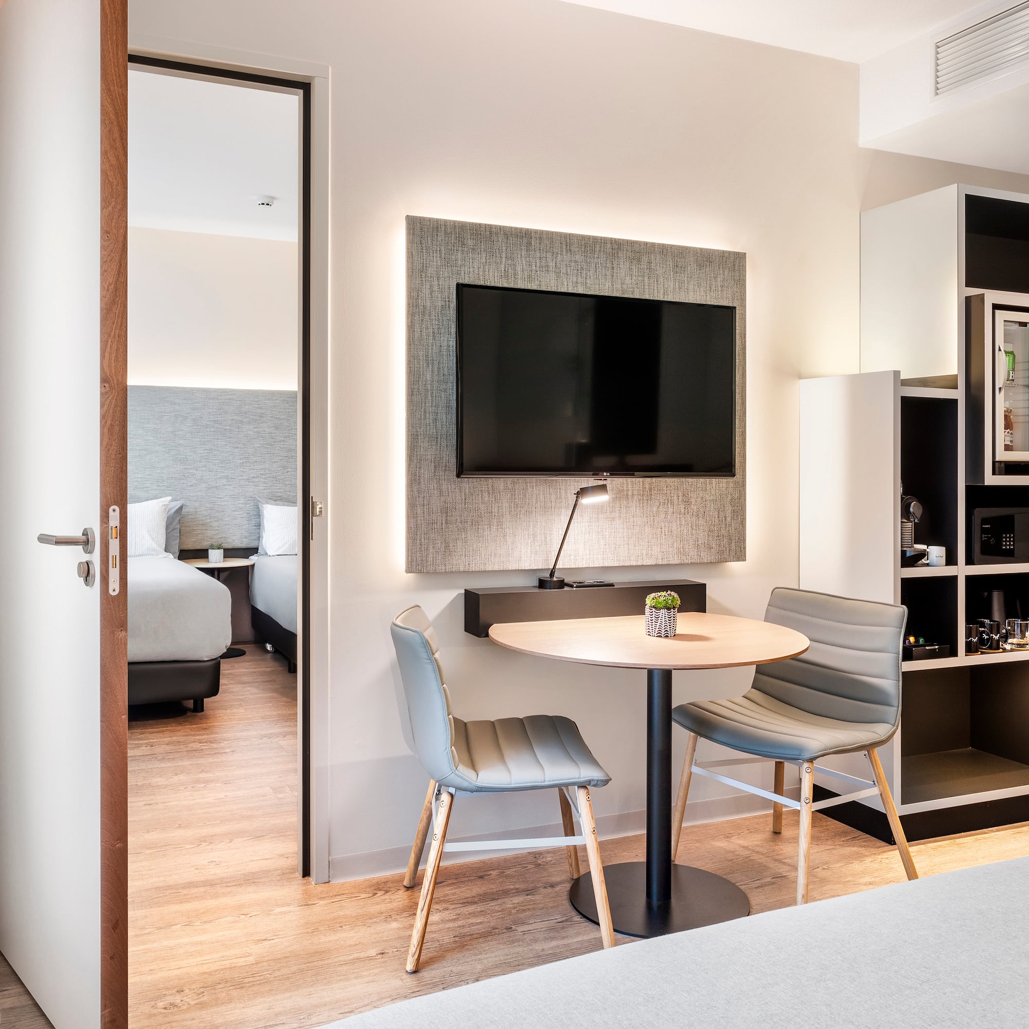 a room with a table and chairs