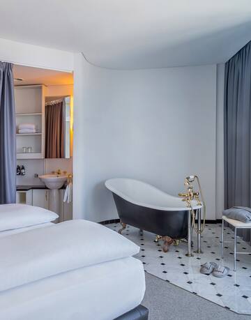 a room with a bathtub and a sink