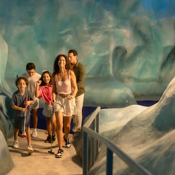 a group of people walking in a cave
