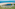 a body of water next to a beach
