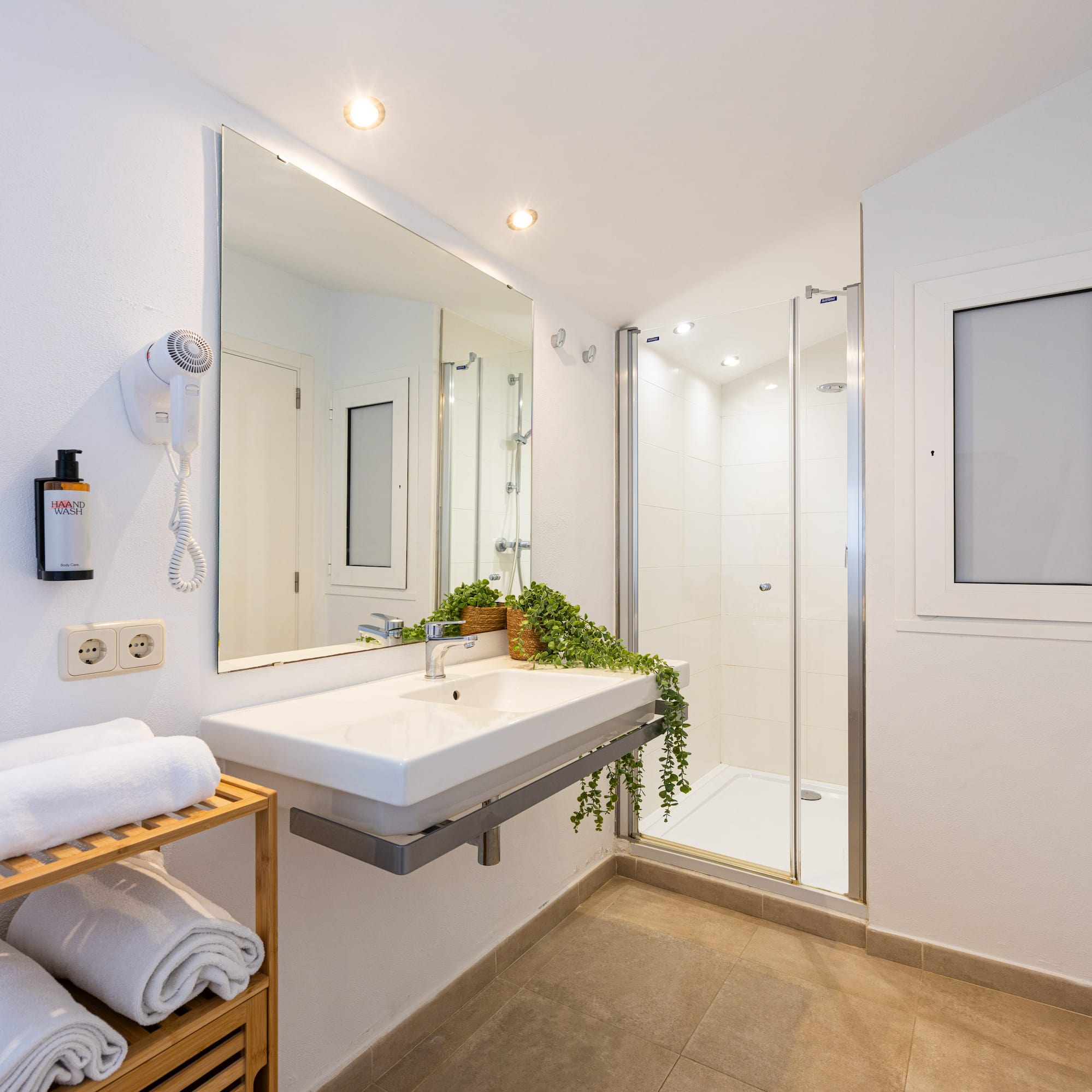 a bathroom with a mirror and sink