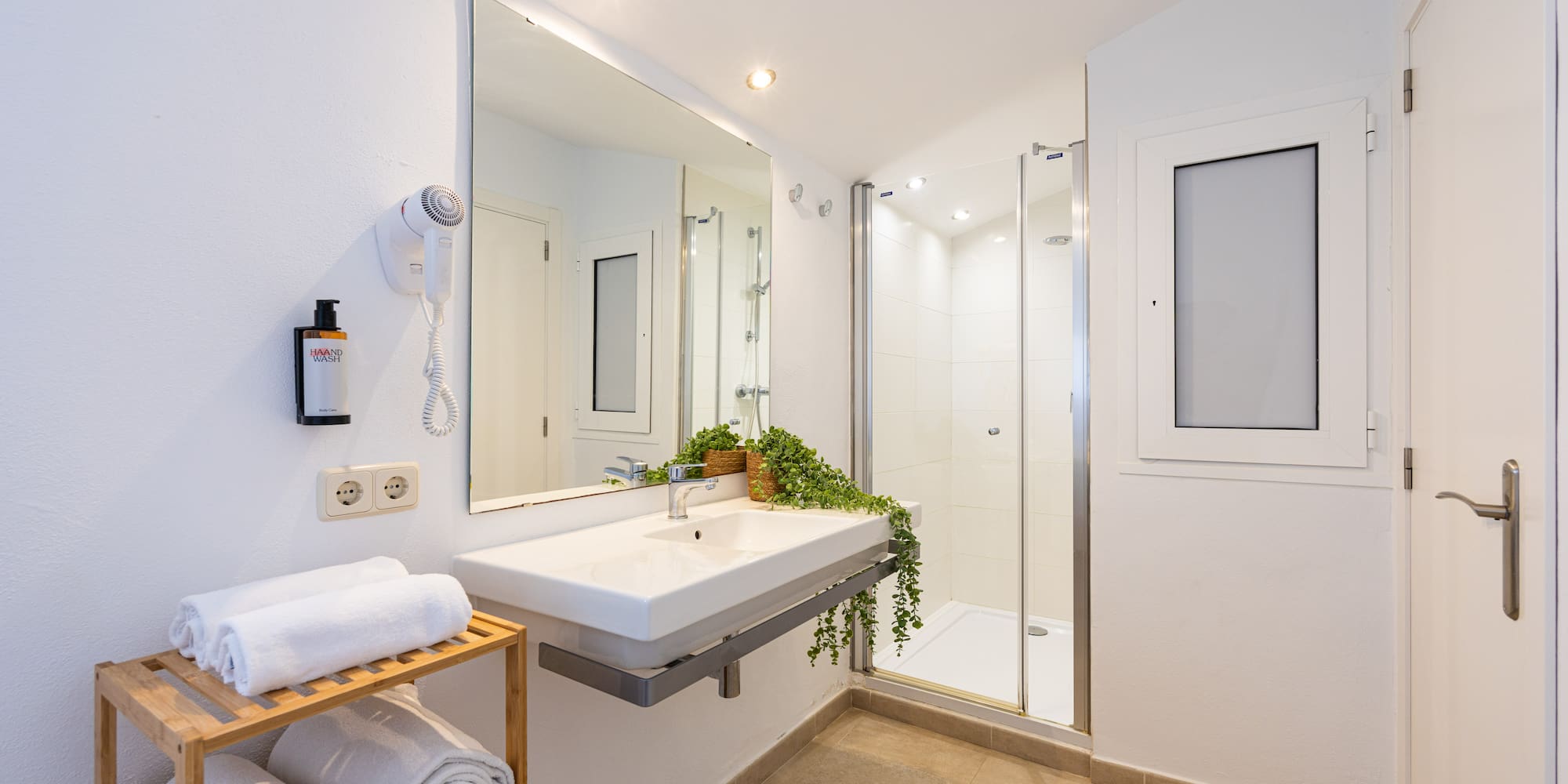 a bathroom with a mirror and sink