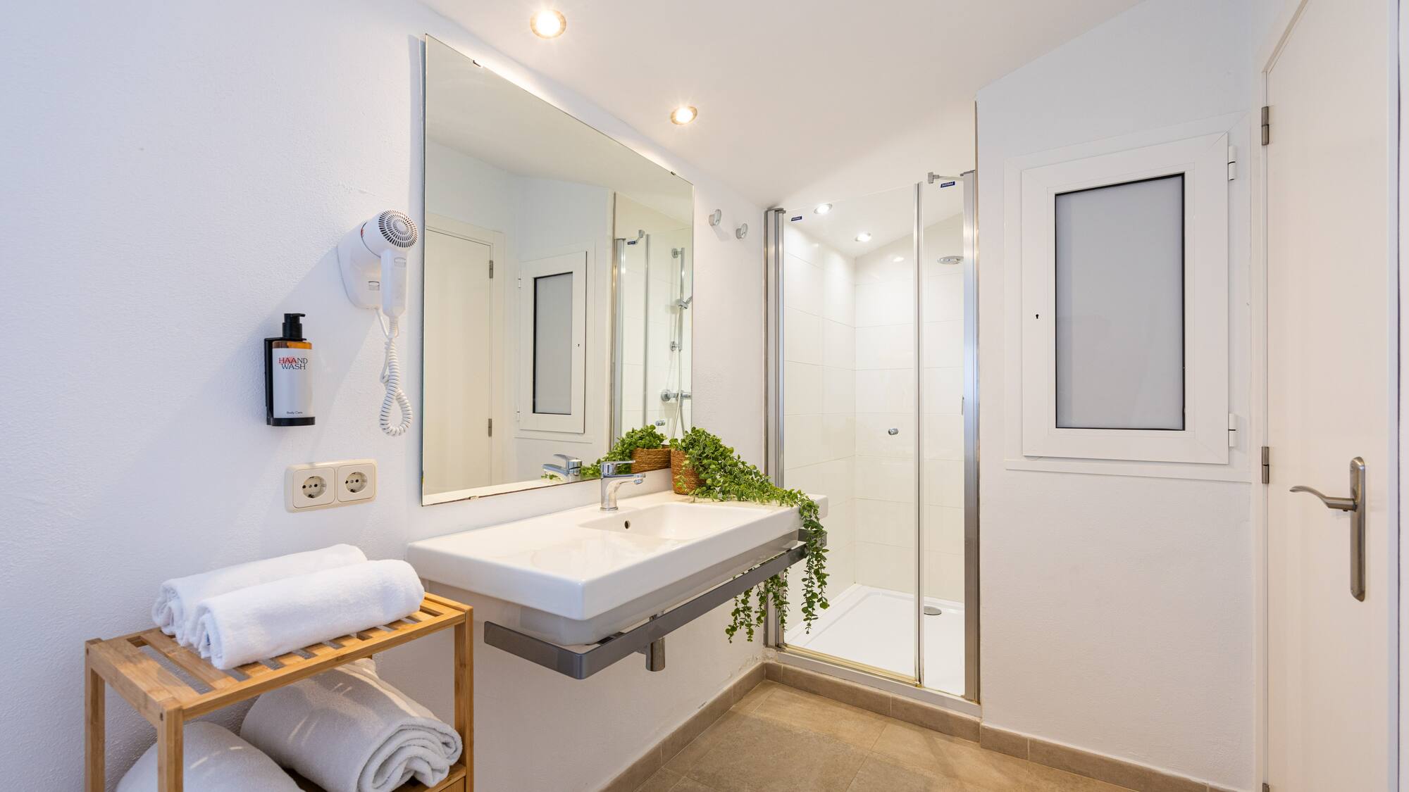 a bathroom with a mirror and sink