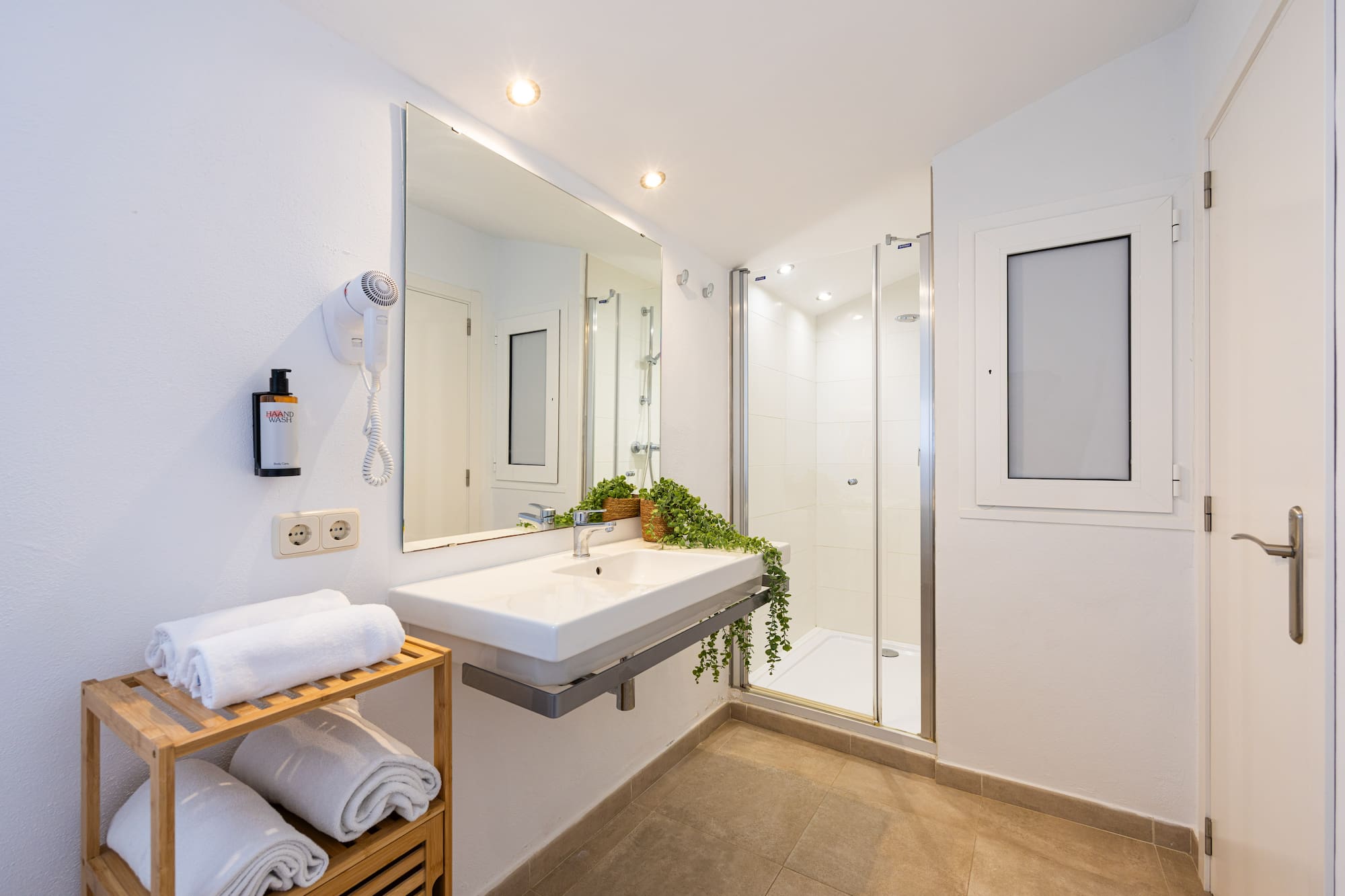 a bathroom with a mirror and sink