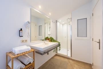 a bathroom with a mirror and sink