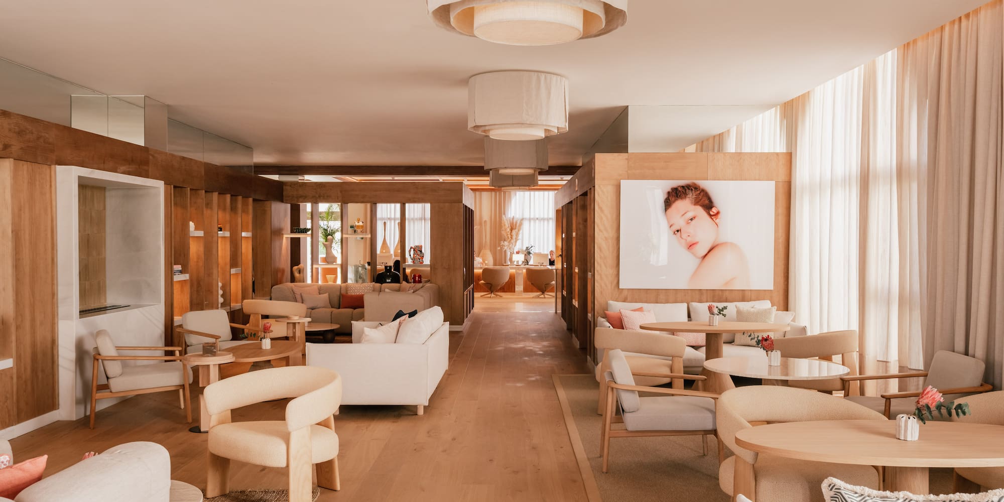 a room with white furniture and a poster