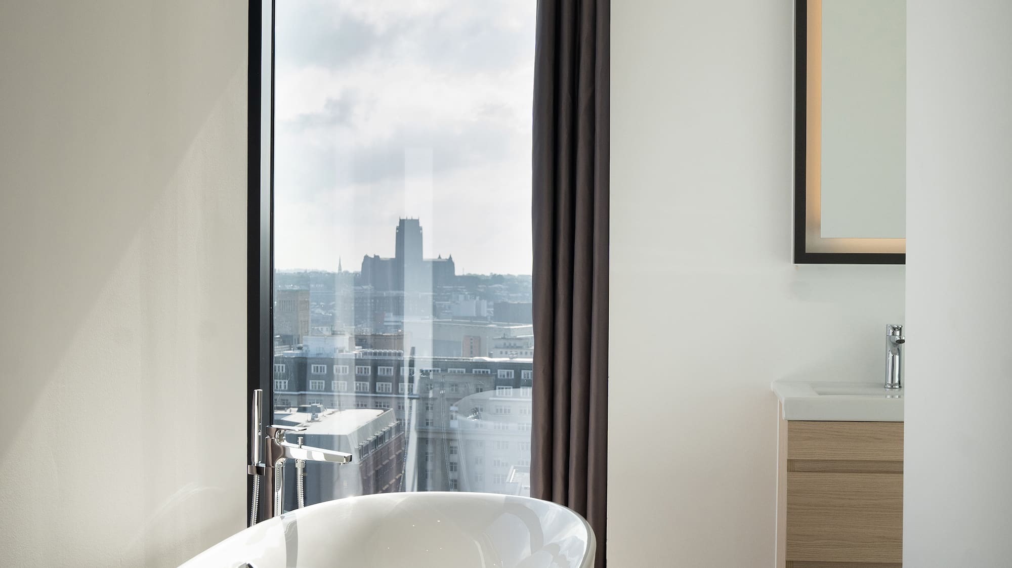 a bathroom with a tub and a window