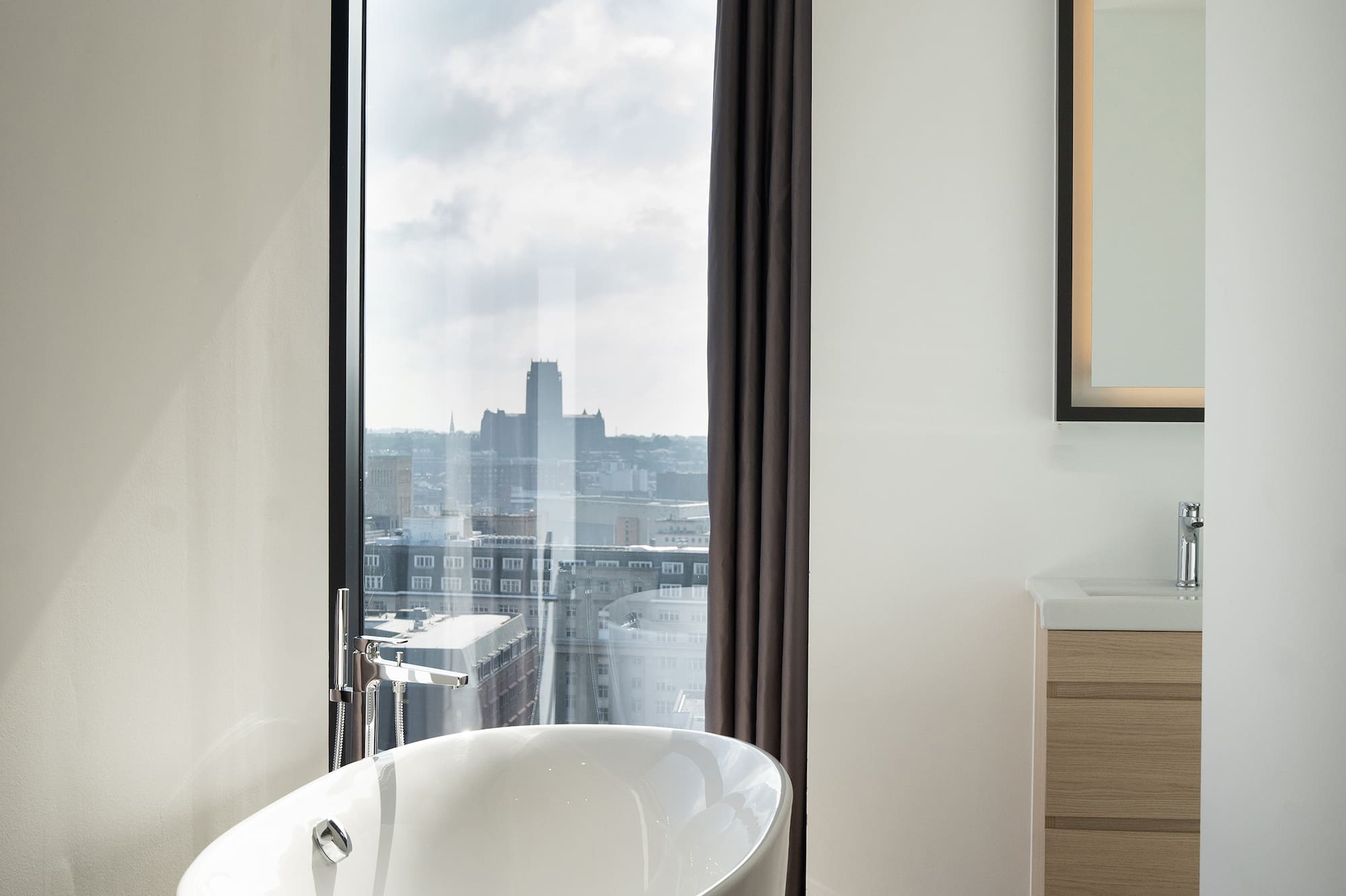 a bathroom with a tub and a window