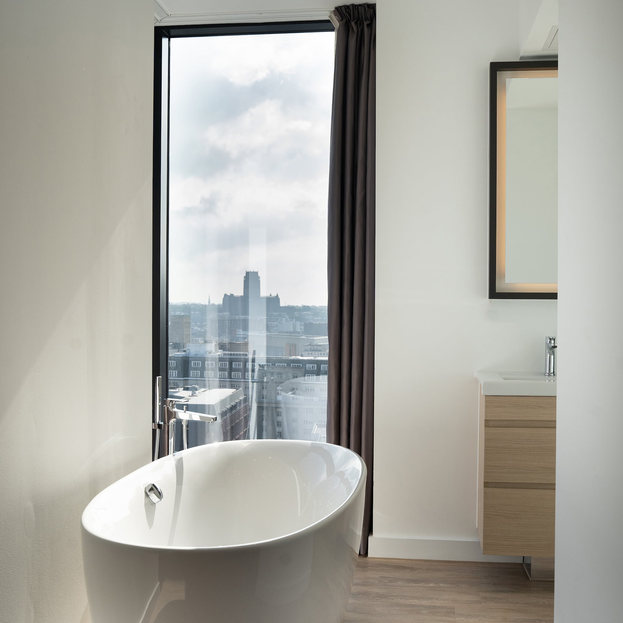 a bathroom with a tub and a window