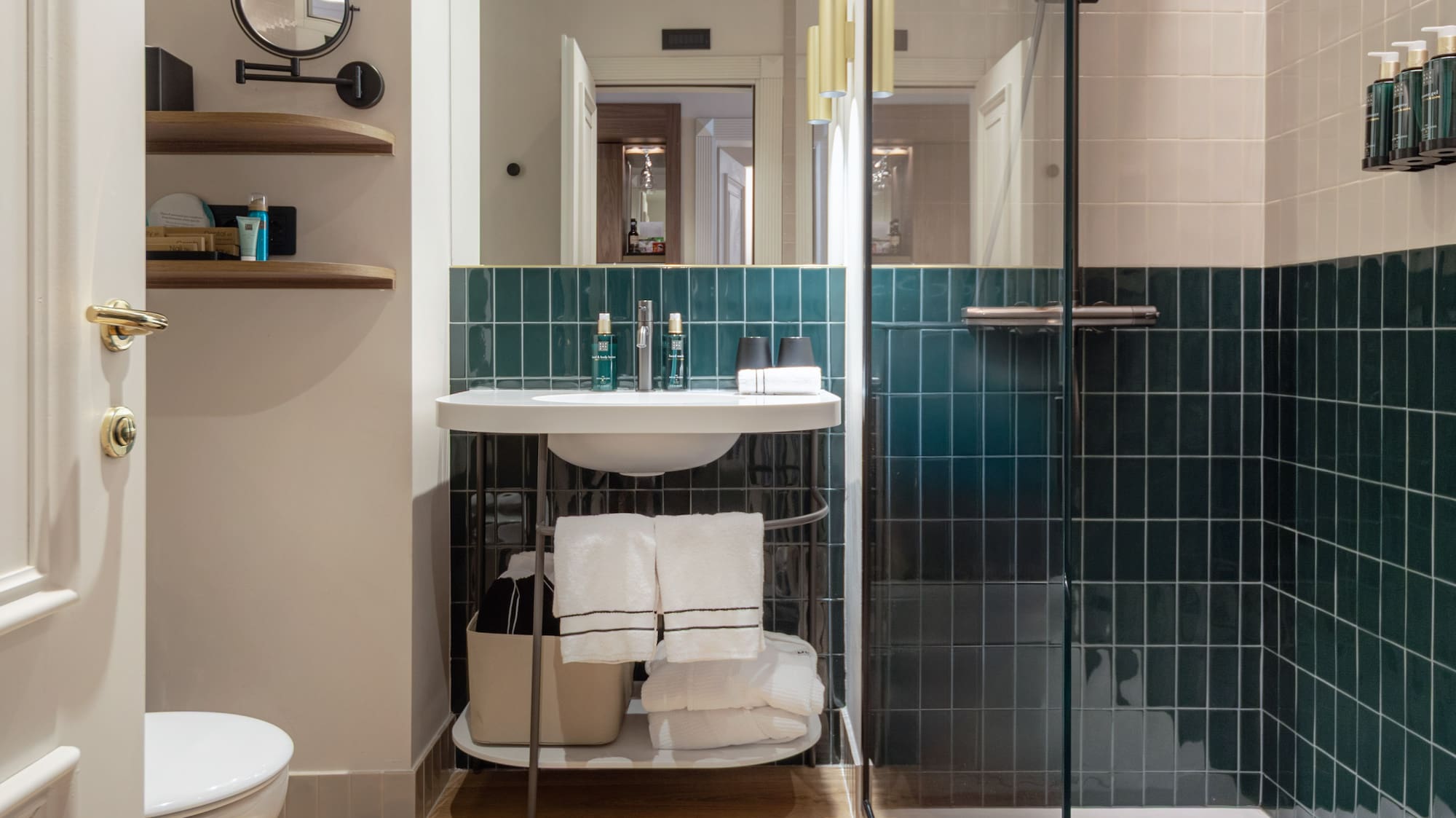 a bathroom with a glass shower door and a sink