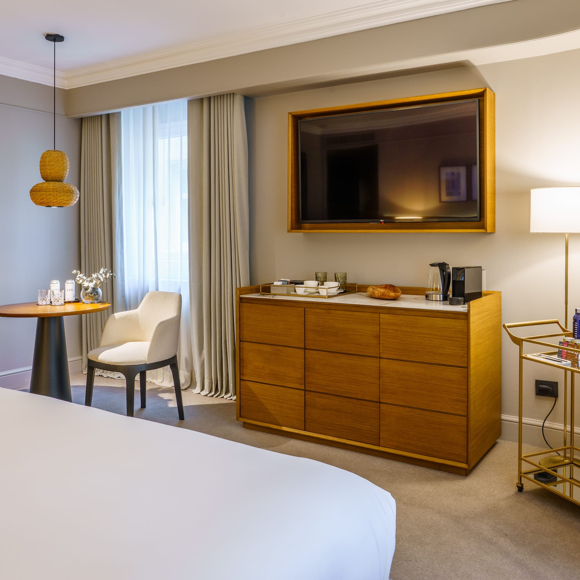 a room with a bed and a television