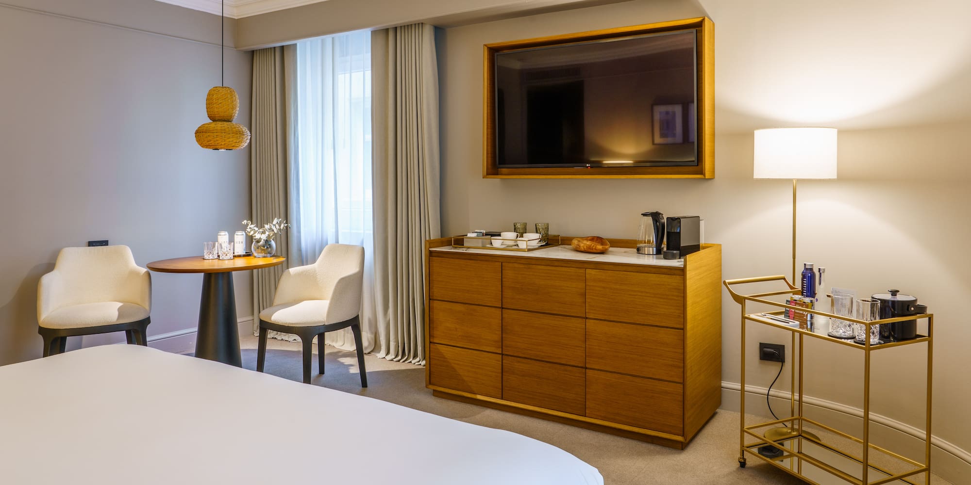 a room with a bed and a television