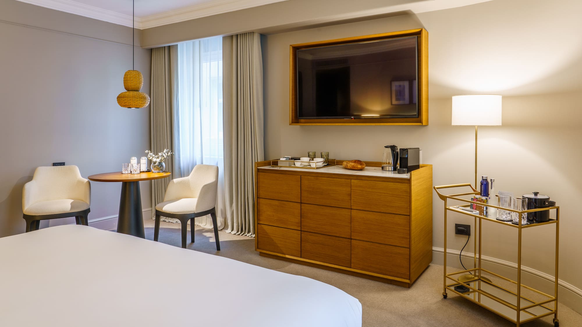 a room with a bed and a television