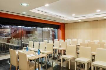 a room with chairs and tables