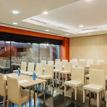 a room with chairs and tables