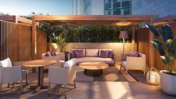 a patio area with a table and chairs