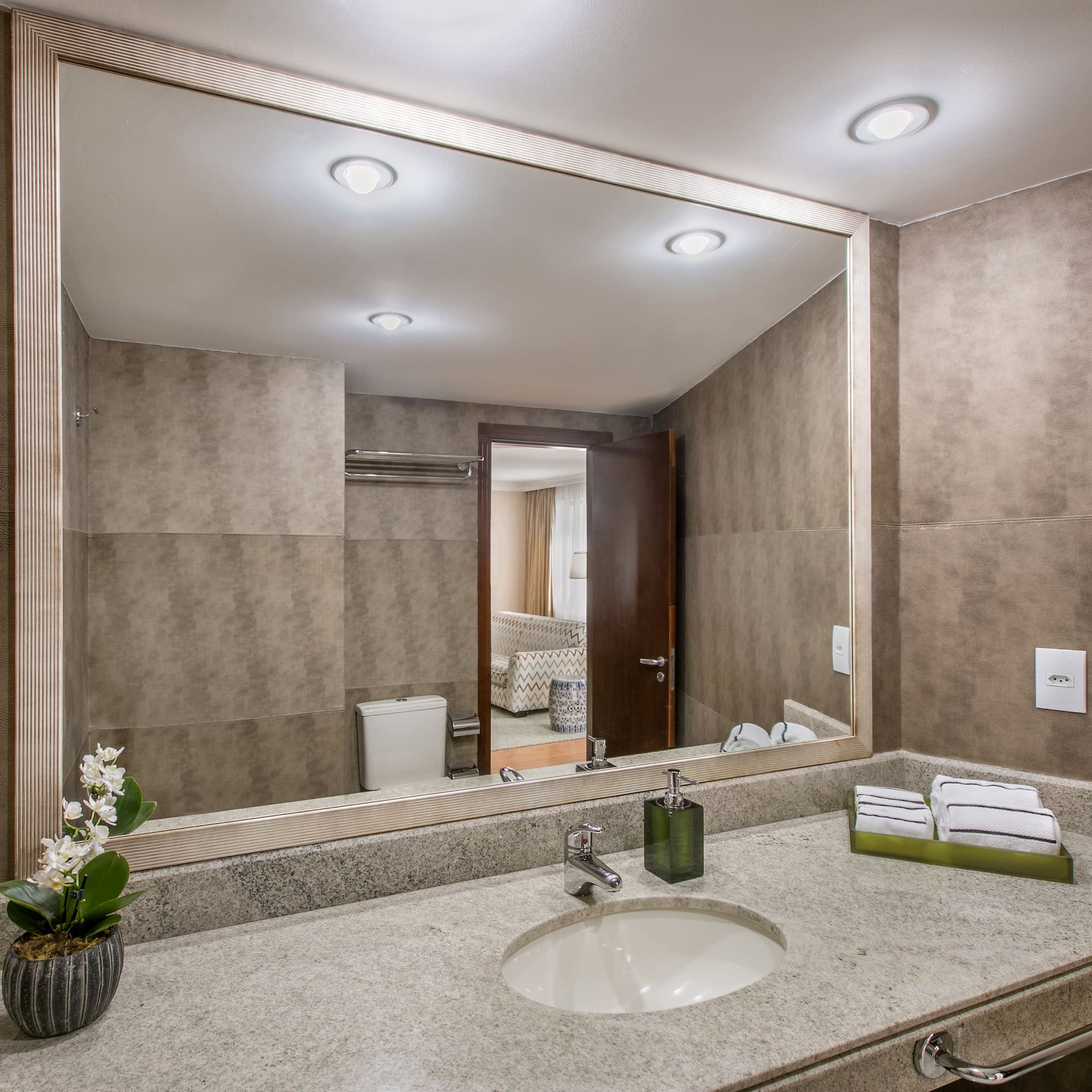 a bathroom with a large mirror