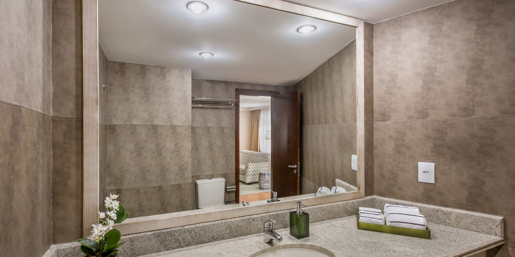 a bathroom with a large mirror