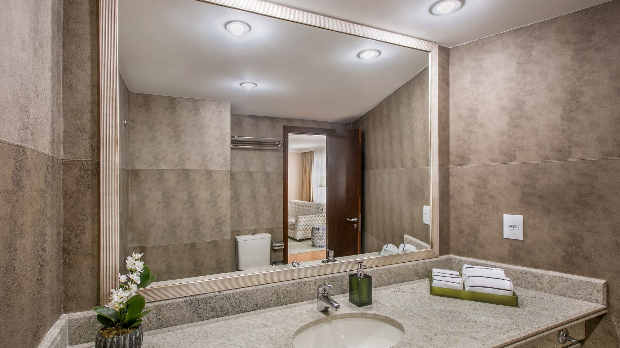 a bathroom with a large mirror