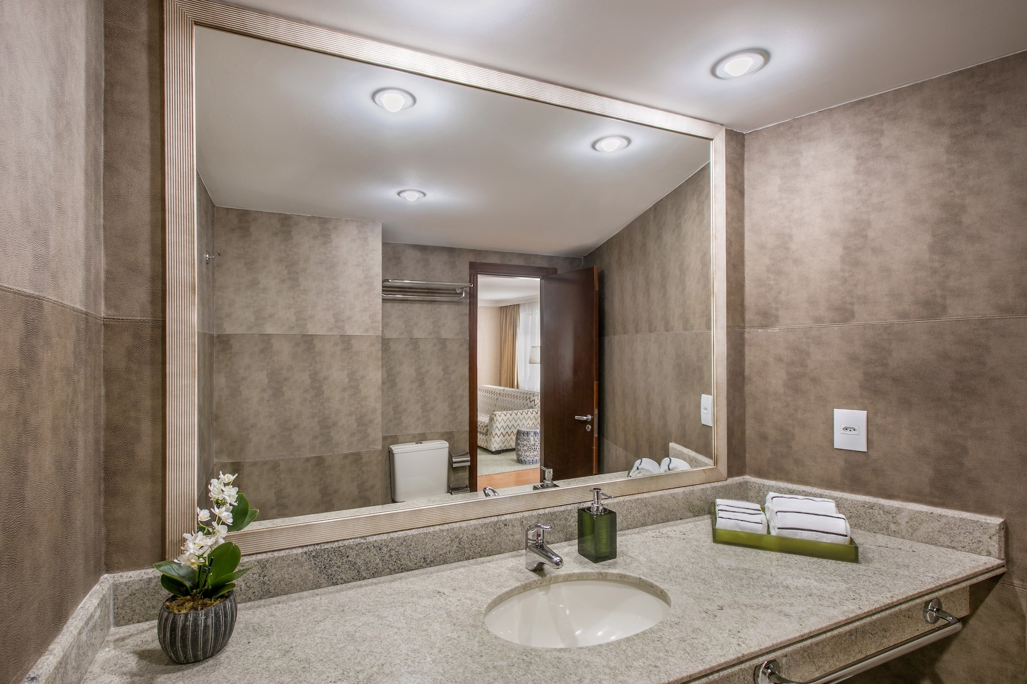 a bathroom with a large mirror